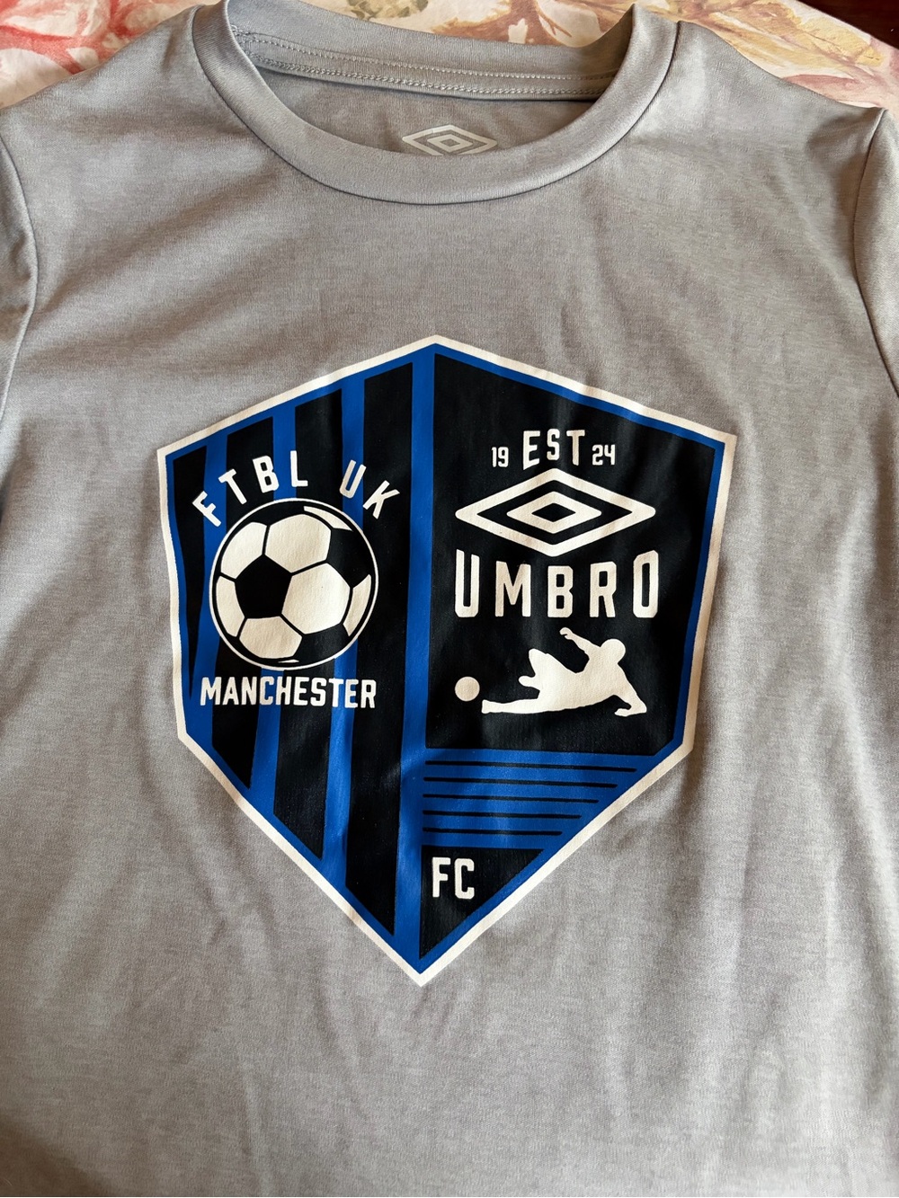 Umbro Gray Tee with Blue & Black Shield Graphic
